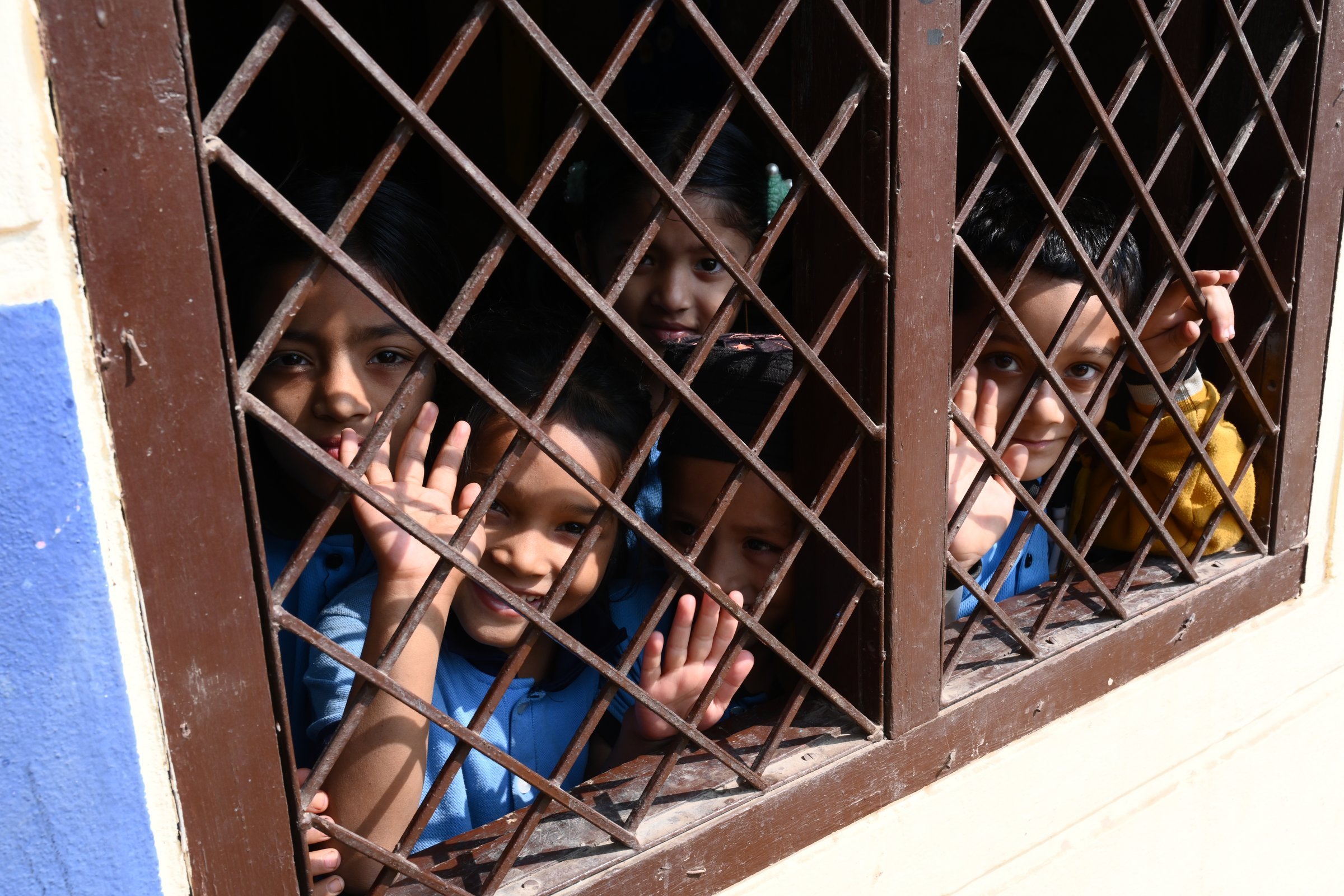 Students at a window between classes
